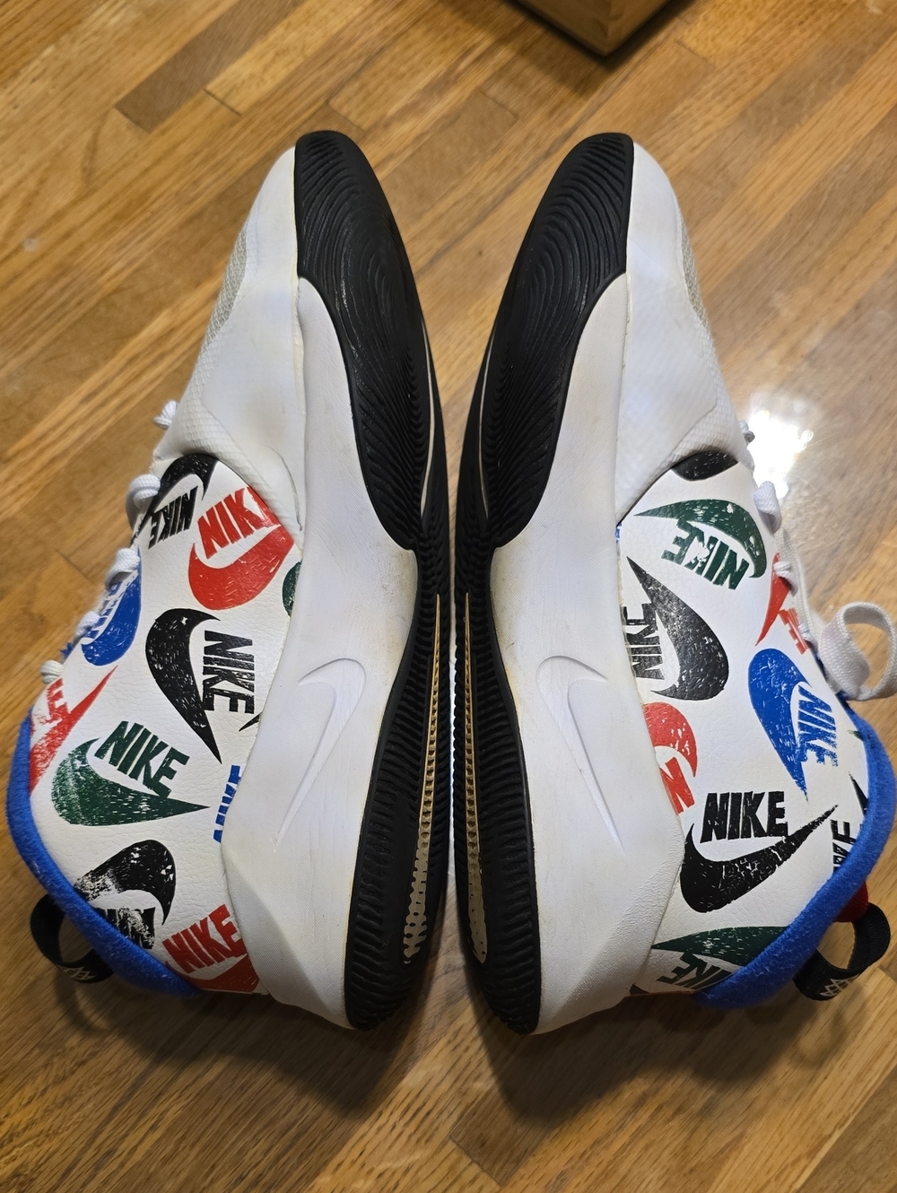 Nike White Sneakers with Multicolor Logo Print